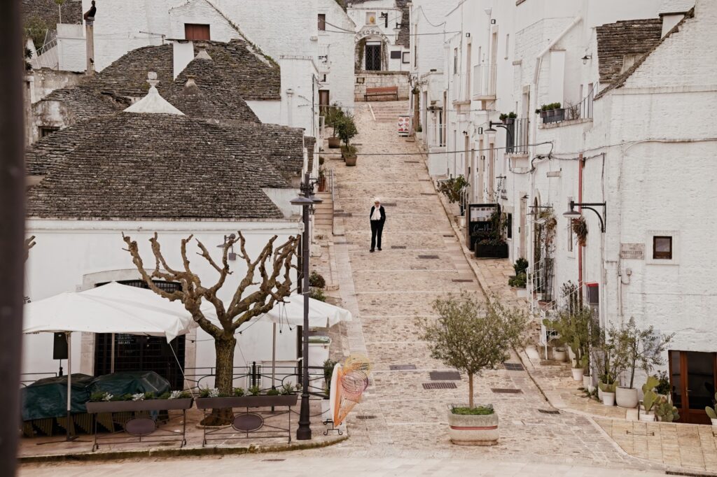 Documentary street scene of a local resident in one of the main streets of Alberobello