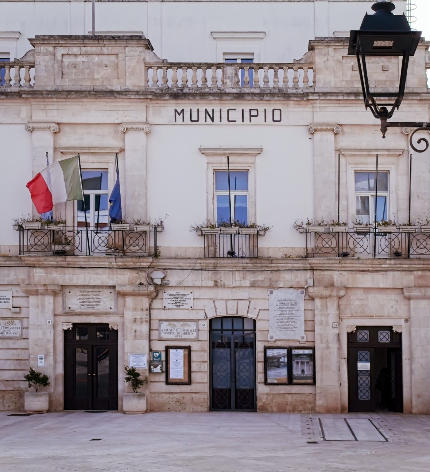 Architectural editorial of the Municipio building in Alberobello, showcasing grand Italian civic architecture