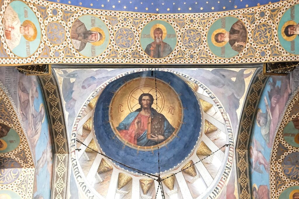 Detail study of Byzantine-style religious mosaics on a curved cathedral ceiling