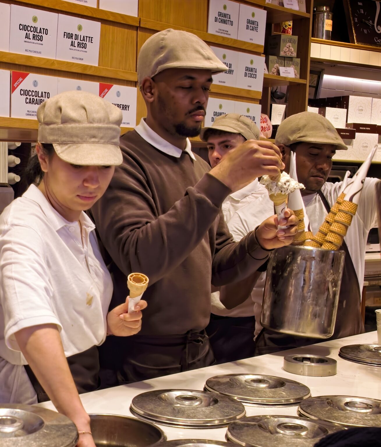 Unobtrusive documentary photography of local artisans working in Bari's Gelateria Gentile, captured by Guy Parker