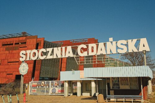 Wide-angle view of the historic Gate No. 2 at the Gdańsk Shipyard, the symbolic entrance to the birthplace of the Solidarity movement.